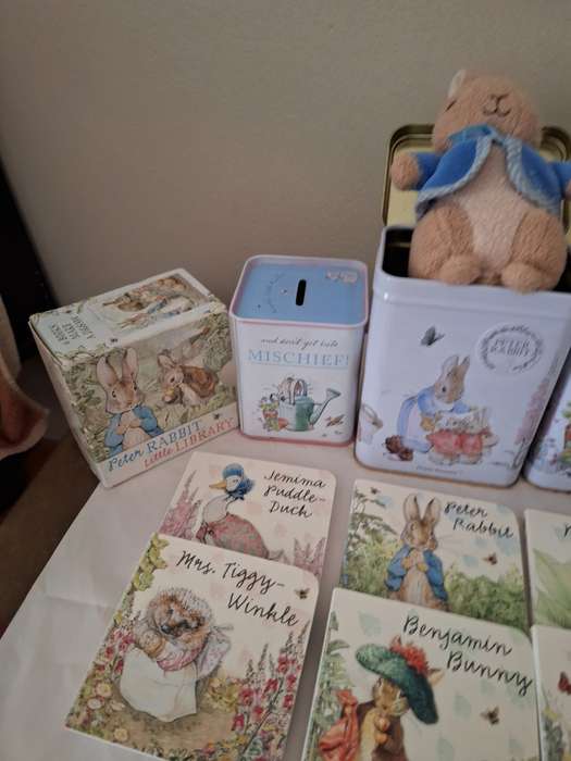 PETER RABBIT  2 TINS WITH PETER RABBIT, PETER RABBIT LITTLE LIBRARY AND MONEY BOX